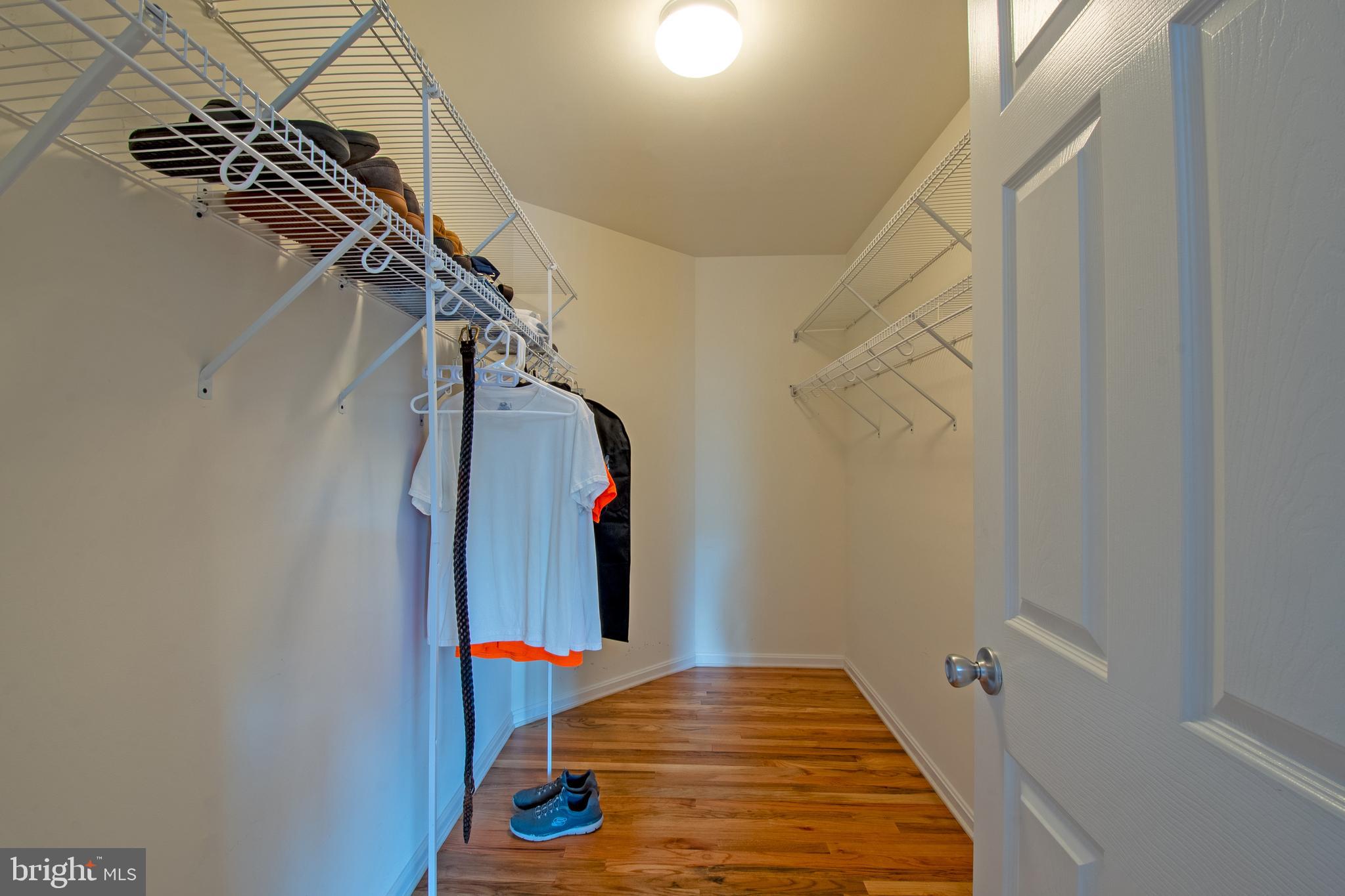 54 Minner Street Houston, DE 19954 - Photo 33 of 55 a view of walk in closet with clothes and shoes