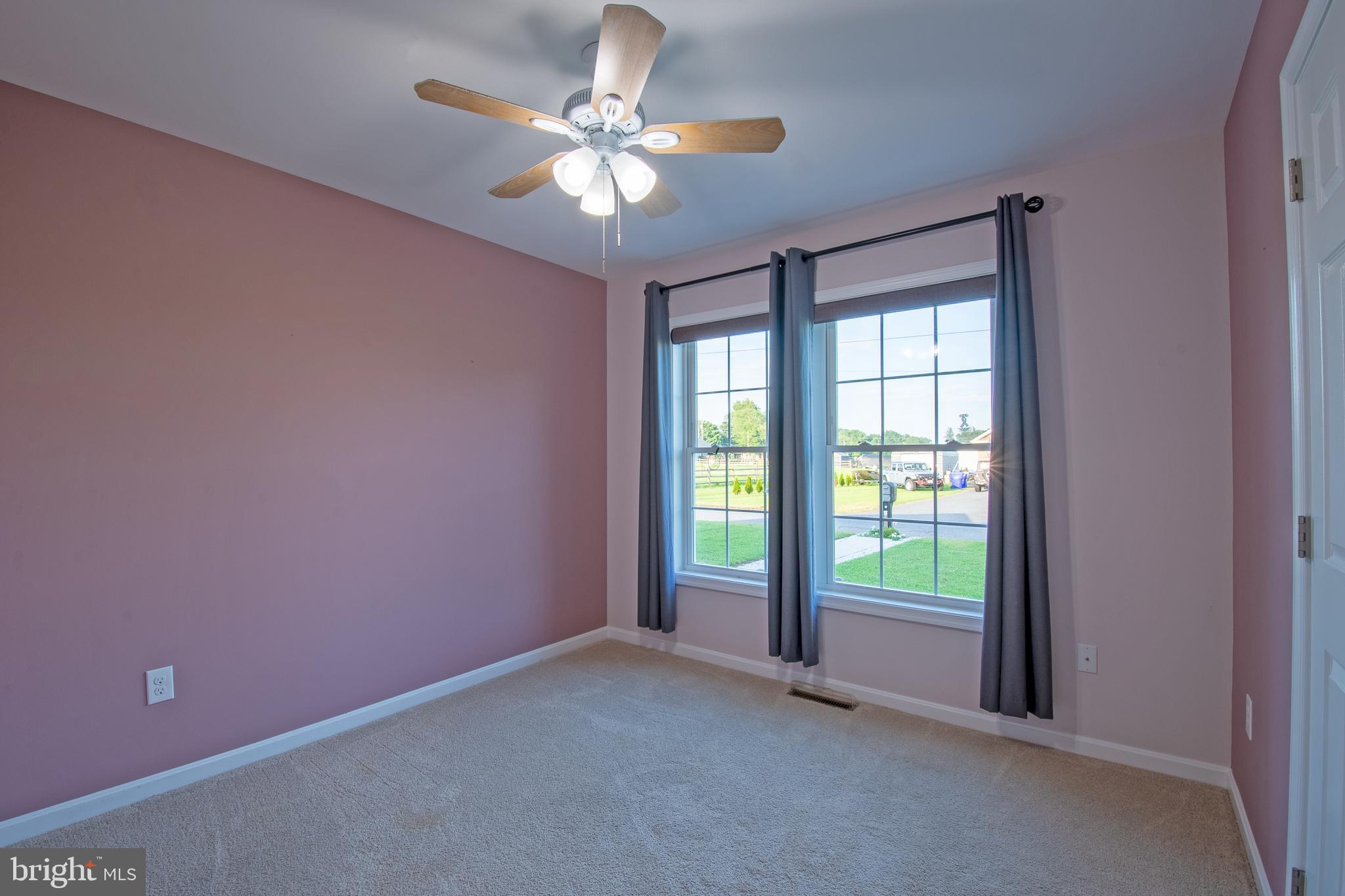 54 Minner Street Houston, DE 19954 - Photo 34 of 55 an empty room with windows and ceiling fan