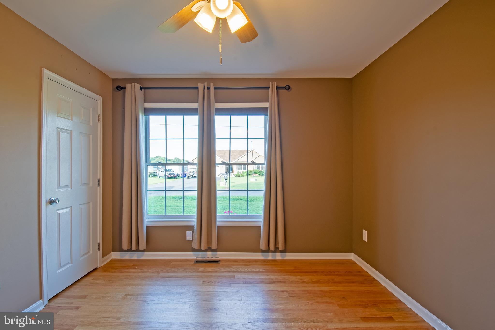 54 Minner Street Houston, DE 19954 - Photo 36 of 55 a view of an empty room with wooden floor and a window