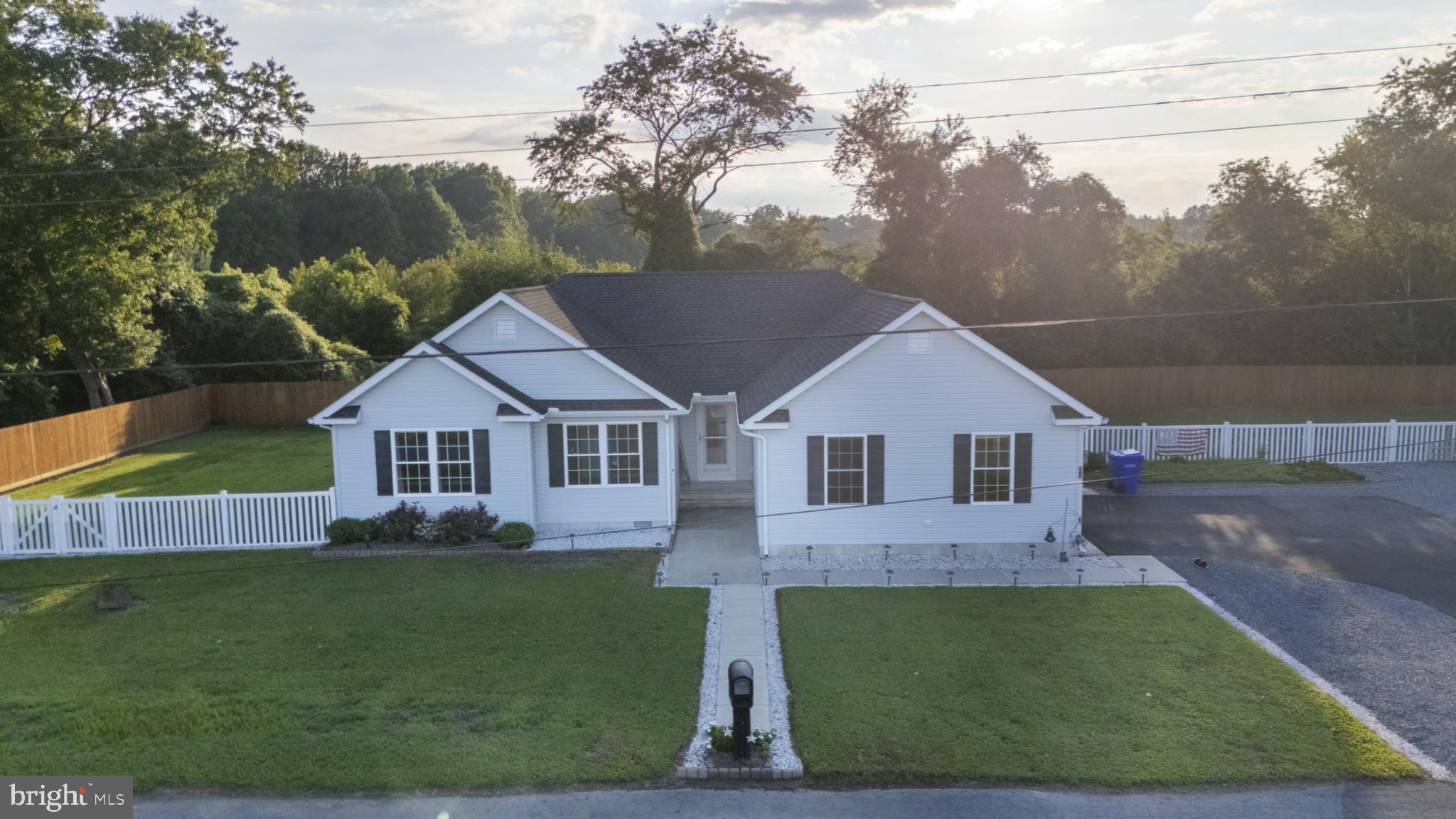 54 Minner Street Houston, DE 19954 - Photo 4 of 55 a front view of a house with a yard and garage