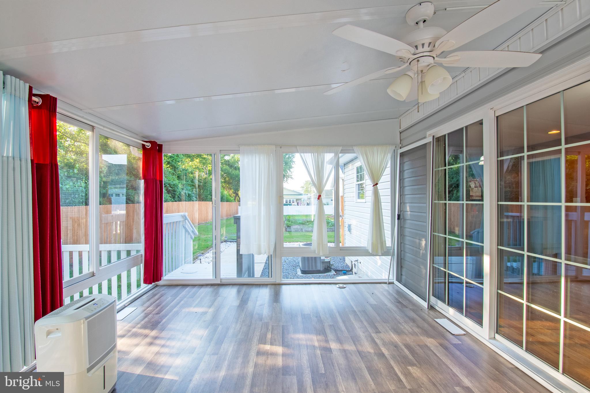 54 Minner Street Houston, DE 19954 - Photo 42 of 55 a view of wooden floor and windows in a room