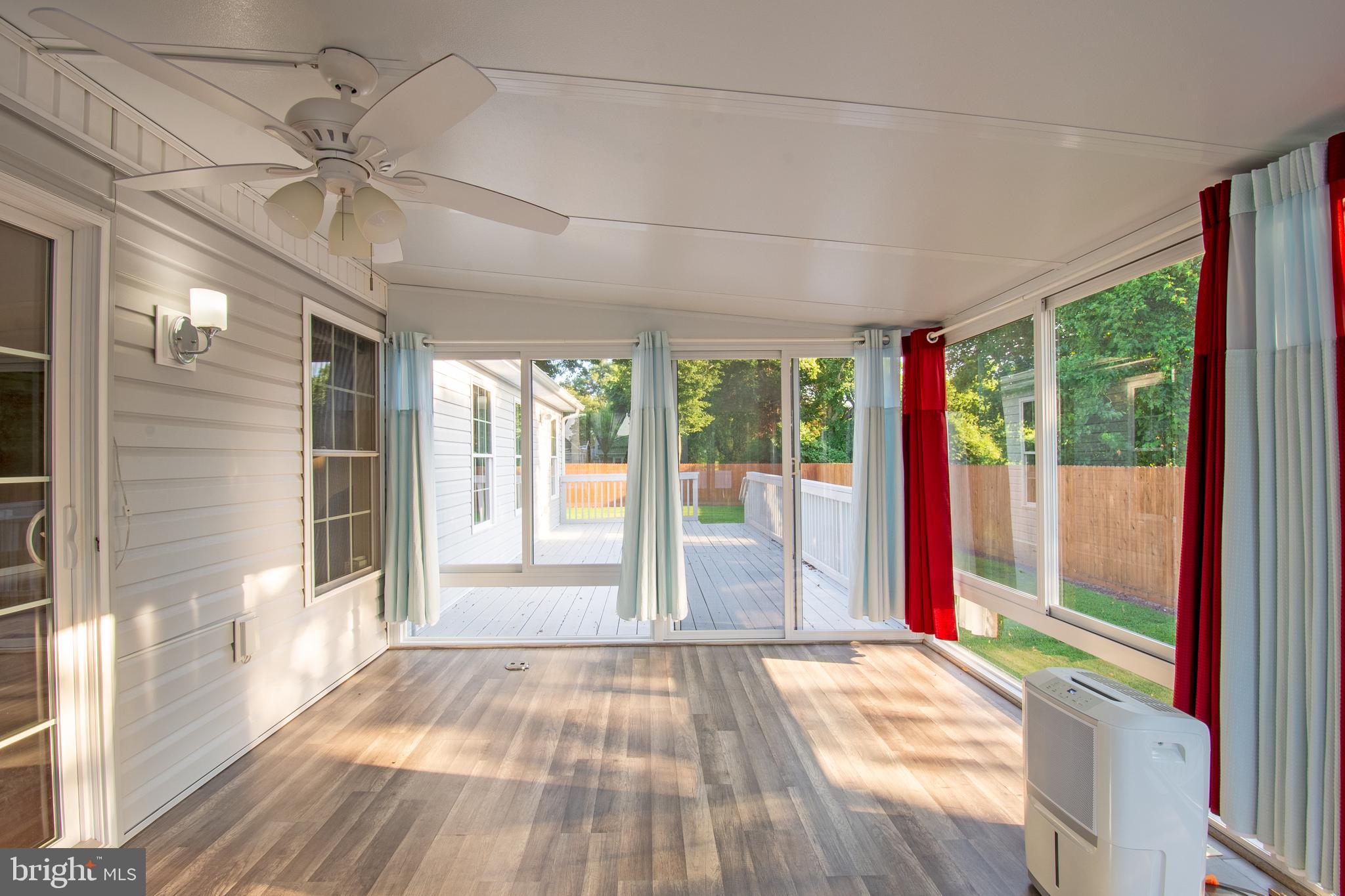 54 Minner Street Houston, DE 19954 - Photo 43 of 55 a view of empty room with wooden floor and fan