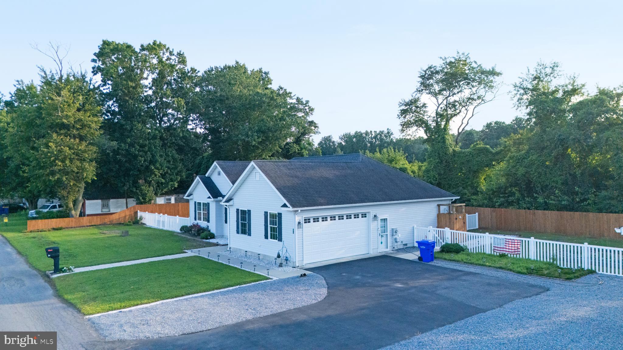 54 Minner Street Houston, DE 19954 - Photo 5 of 55 a house with trees in the background
