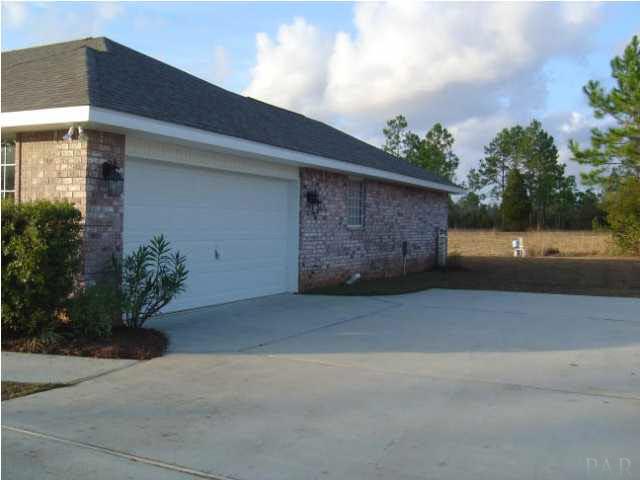3494 Acy Lowery Road Pace, FL 32571 - Photo 5 of 8 Long Driveway with 2-Car Garage