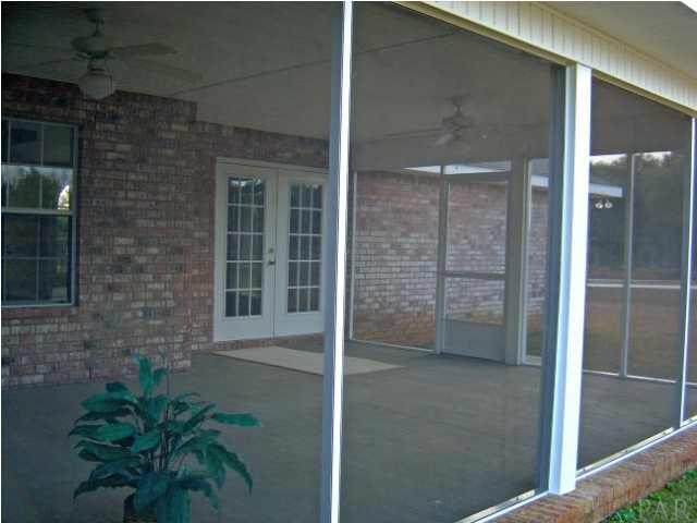 3494 Acy Lowery Road Pace, FL 32571 - Photo 7 of 8 Screened Back Patio