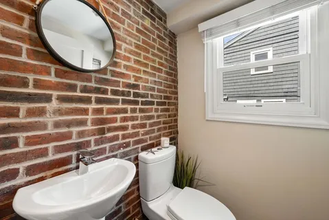 a bathroom with a toilet and a sink