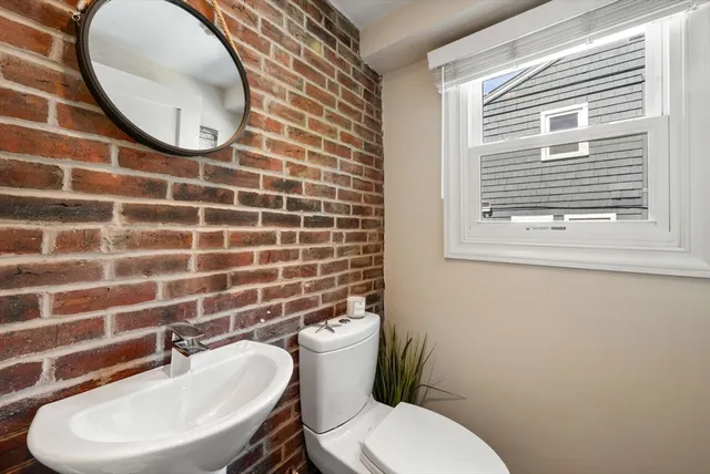 a bathroom with a toilet and a sink