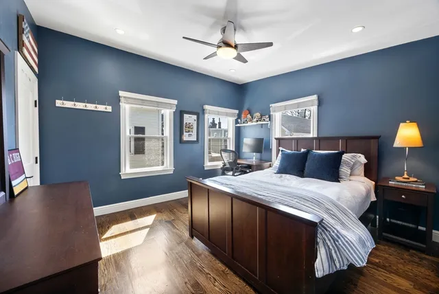 a bedroom with bed and window