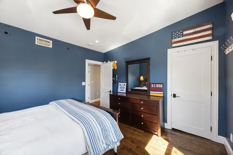 a bedroom with a bed and a dresser