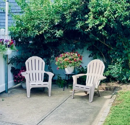 a wooden bench in a garden