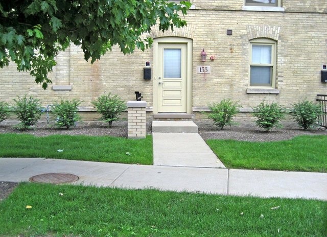 155 Whistler Road Highland Park, IL 60035 - Photo 12 of 13 a front view of a house with a yard and a garage