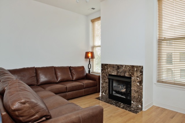 155 Whistler Road Highland Park, IL 60035 - Photo 4 of 13 a living room with furniture a window and a fireplace