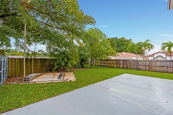 a view of backyard with green space