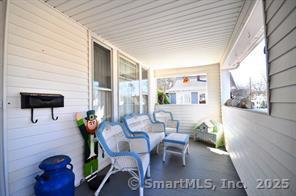 42 Oakland Street, Unit 2 Bristol, CT 06010 - Photo 3 of 13 a living room with furniture and a large window