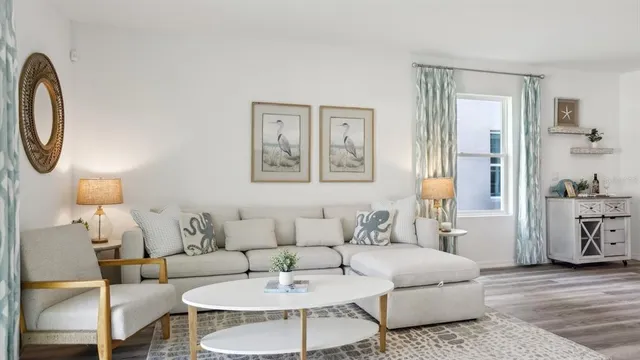 a living room with furniture and a table