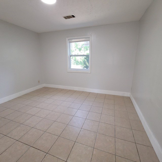 2406 Dawson Street, Unit 2 Columbus, GA 31903 - Photo 6 of 10 an empty room with white walls and window