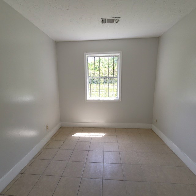 2406 Dawson Street, Unit 2 Columbus, GA 31903 - Photo 8 of 10 a view of an empty room with a window