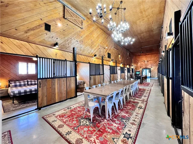 a dining room with a table and chairs