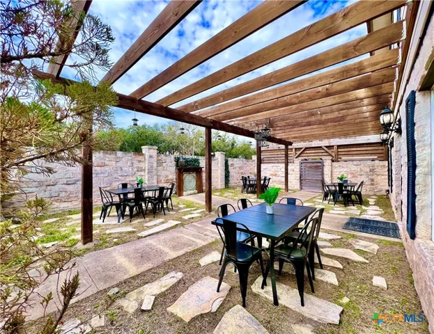 a view of kitchen island with a table and chairs in it