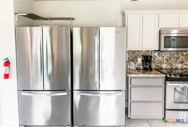 a view of a porch with a door and a window