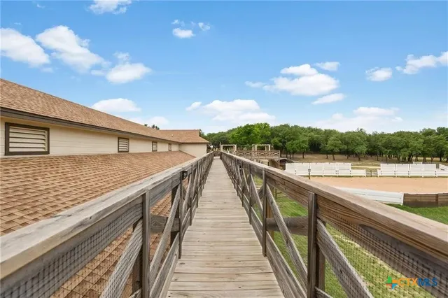 a view of balcony with furniture