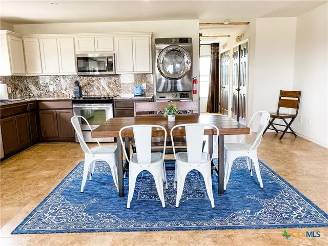 a view of livingroom with furniture and window