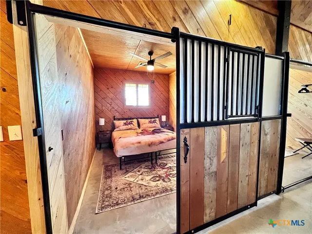 a view of a porch with a door and chair