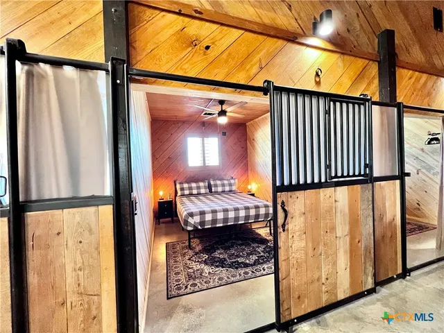 a bathroom with a double vanity sink toilet and shower