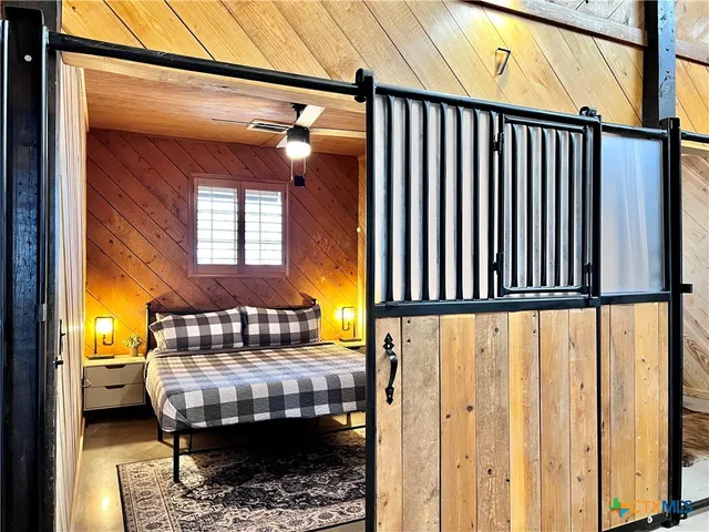 a balcony with furniture and wooden floor