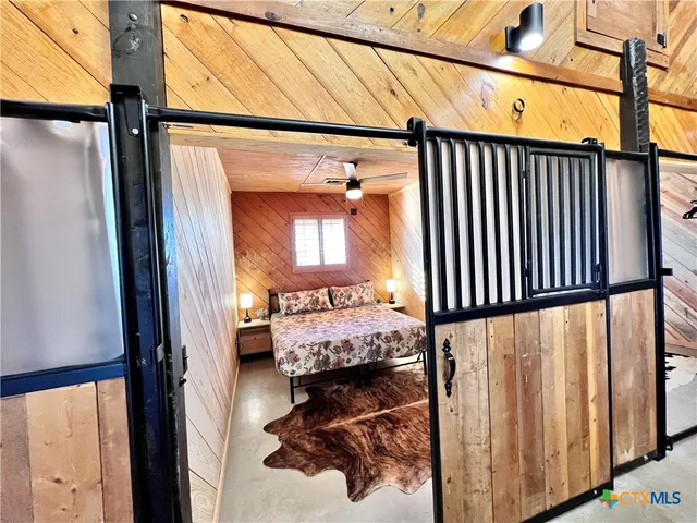 a bathroom with a sink vanity mirror and toilet
