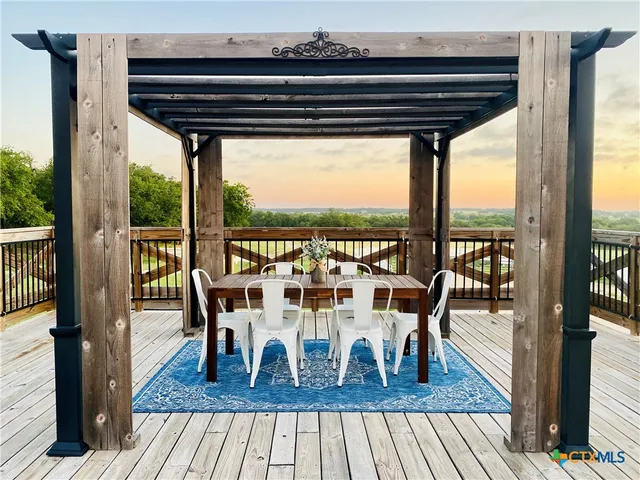 a view of a table and chairs in patio