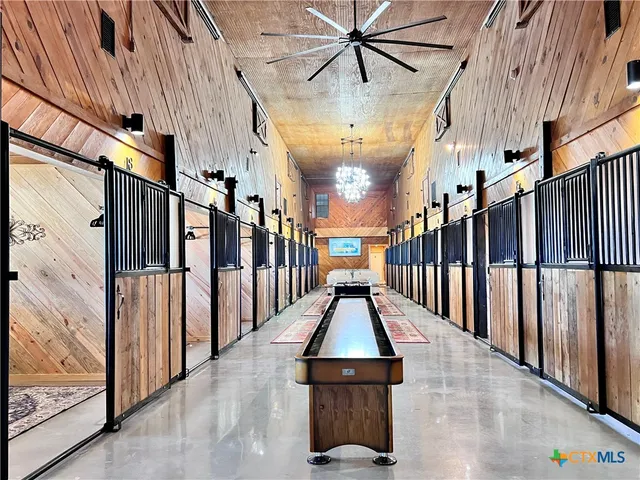 a kitchen with white cabinets sink and stainless steel appliances