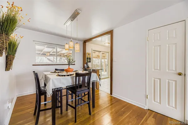 a view of a dining room with furniture window and outside view