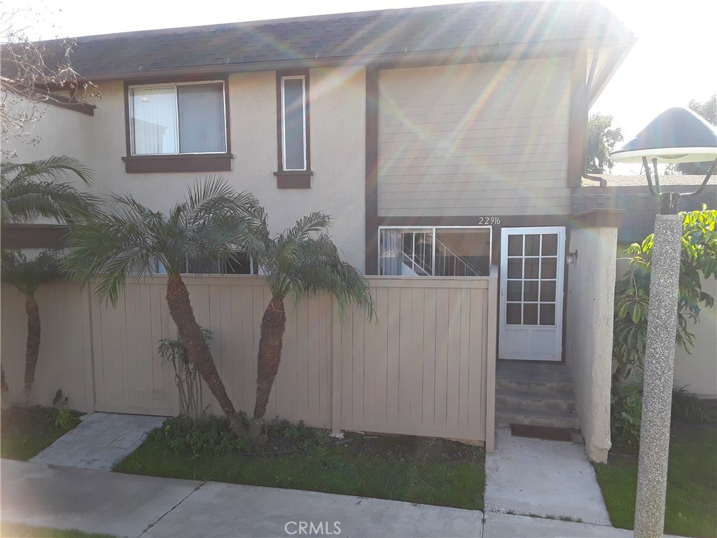 22916 Vía Nuez, Unit 39 Mission Viejo, CA 92691 - Photo 1 of 12 a front view of a house with a yard