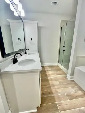 a bathroom with a sink and mirror