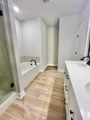 a bathroom with a sink and a shower