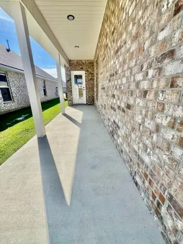 a view of an entryway with backyard of house