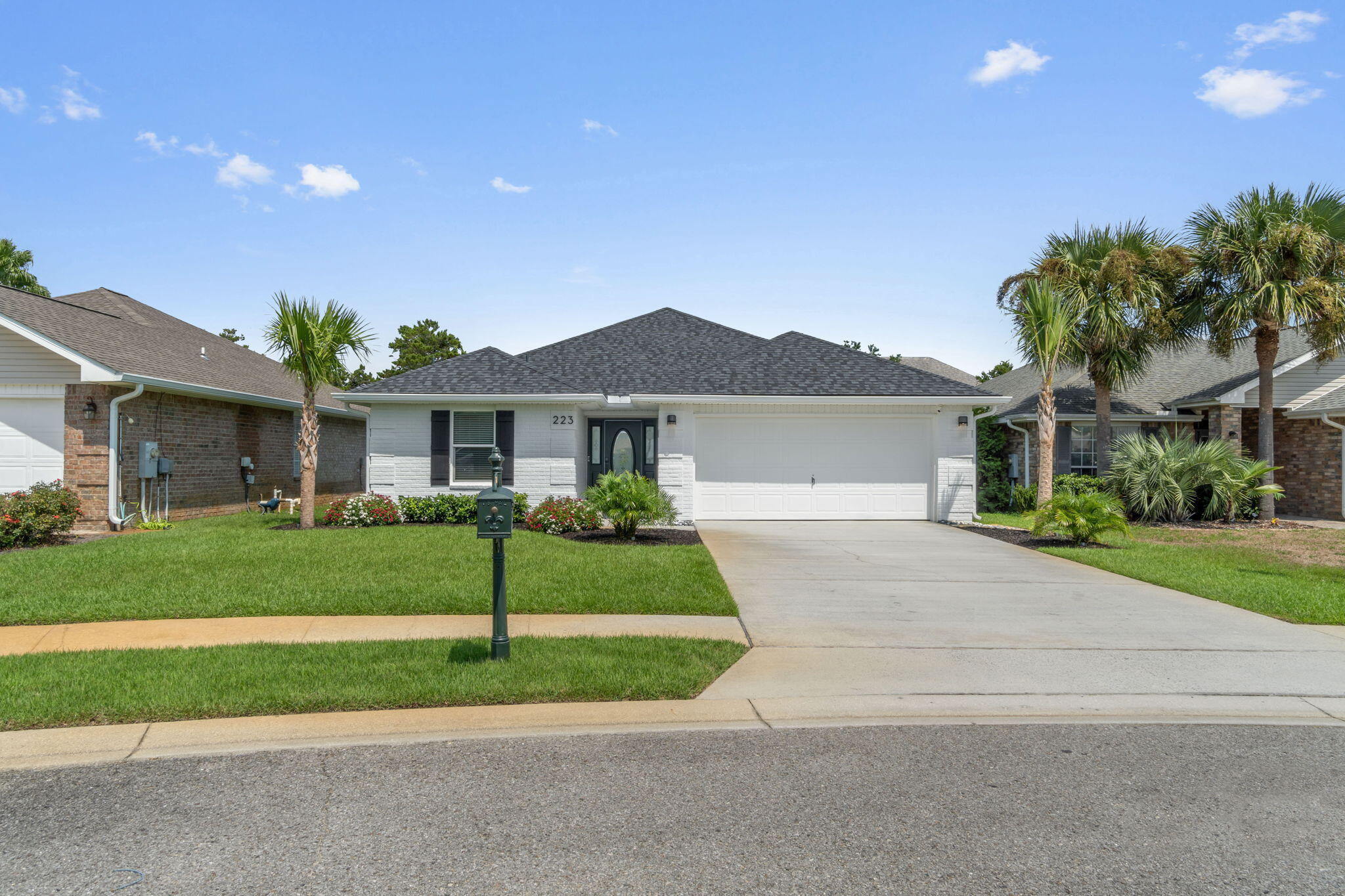 223 Sandy Cay Drive Miramar Beach, FL 32550 - Photo 17 of 79 front view of a house and a yard