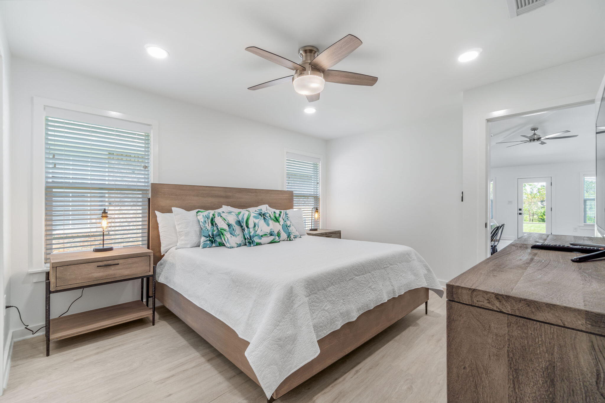 223 Sandy Cay Drive Miramar Beach, FL 32550 - Photo 19 of 79 a bedroom with a large bed and a chandelier