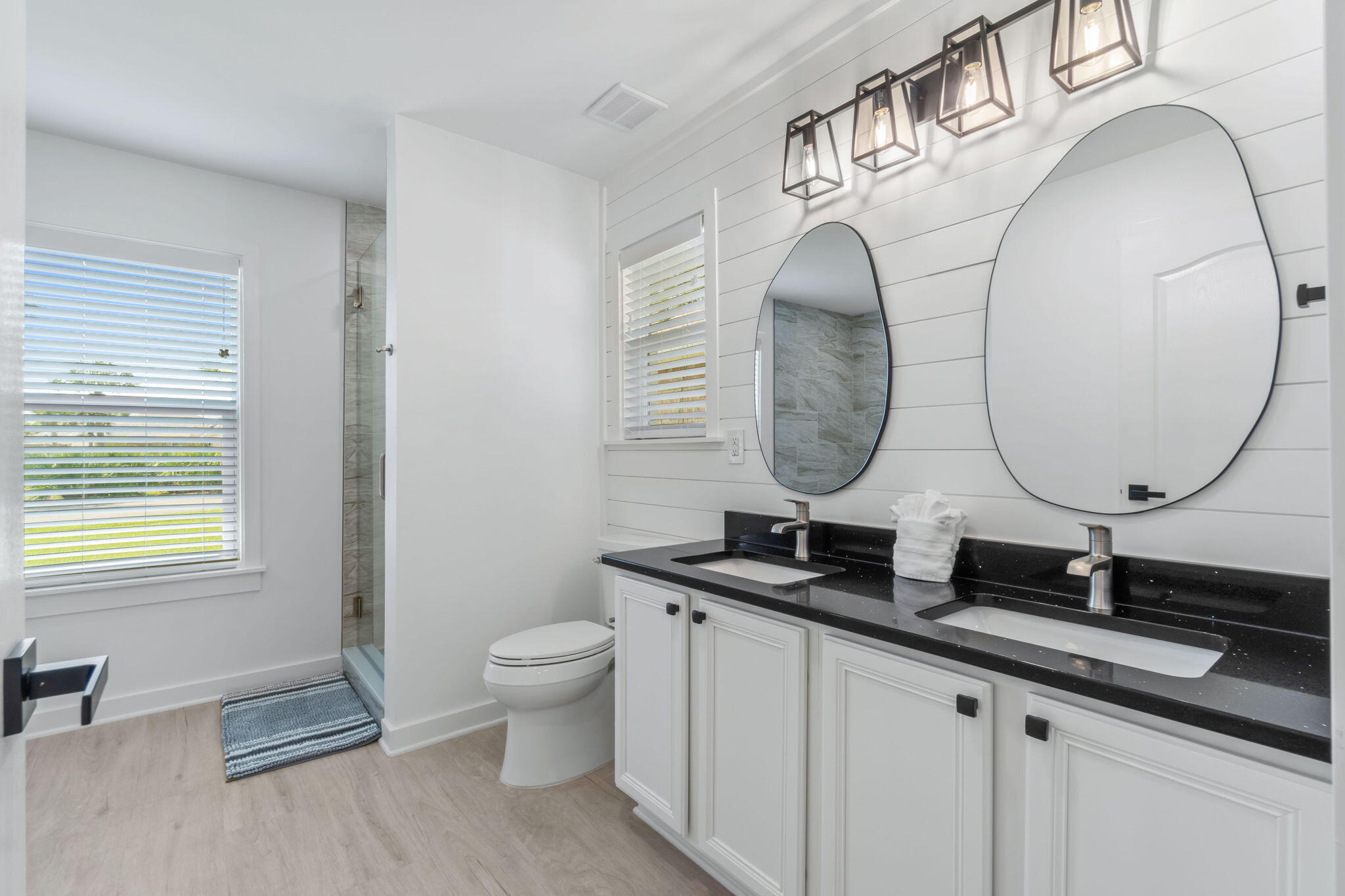 223 Sandy Cay Drive Miramar Beach, FL 32550 - Photo 21 of 79 a bathroom with a double vanity sink and a mirror