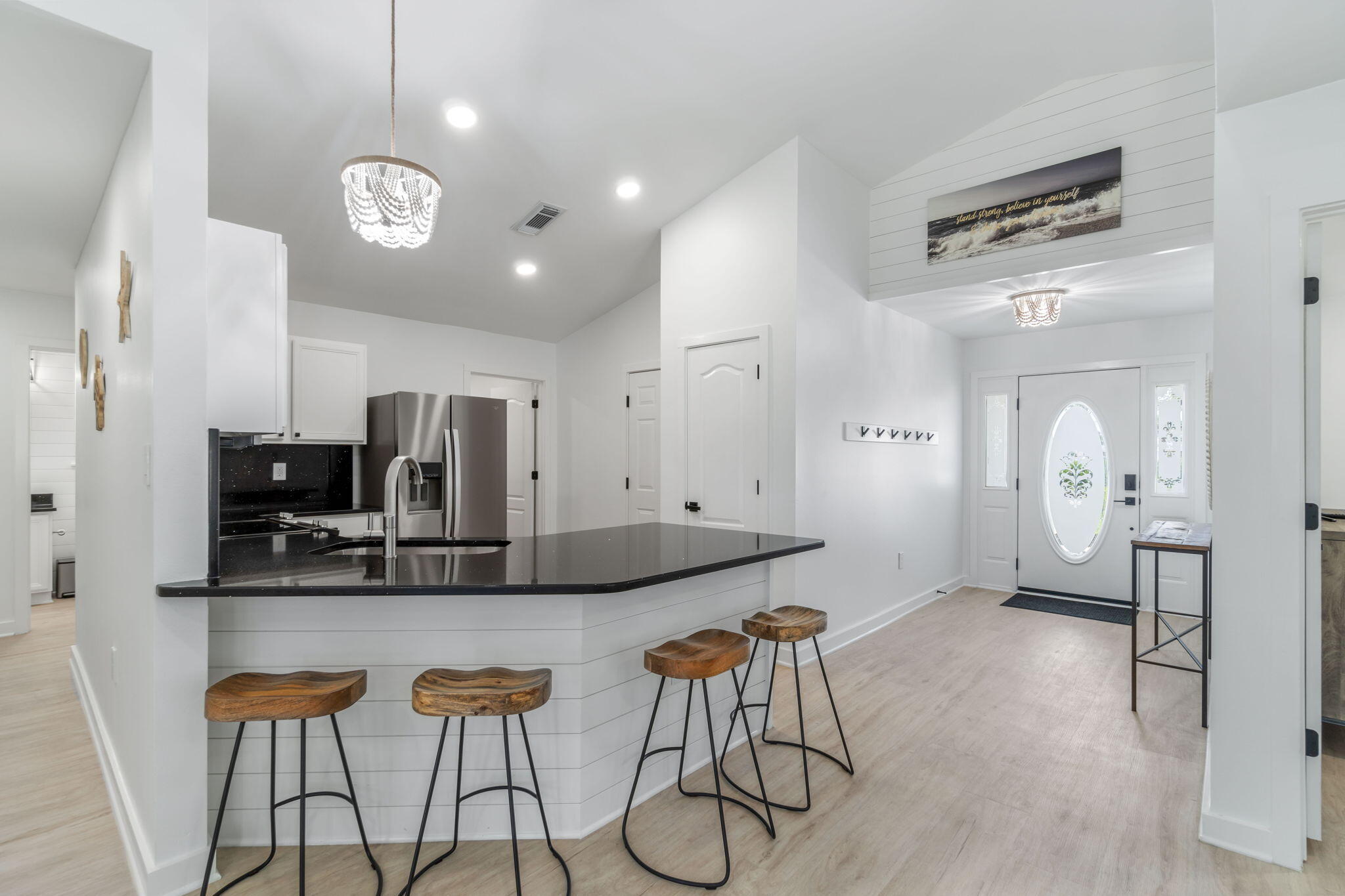 223 Sandy Cay Drive Miramar Beach, FL 32550 - Photo 29 of 79 a kitchen with stainless steel appliances kitchen island granite countertop a sink and cabinets