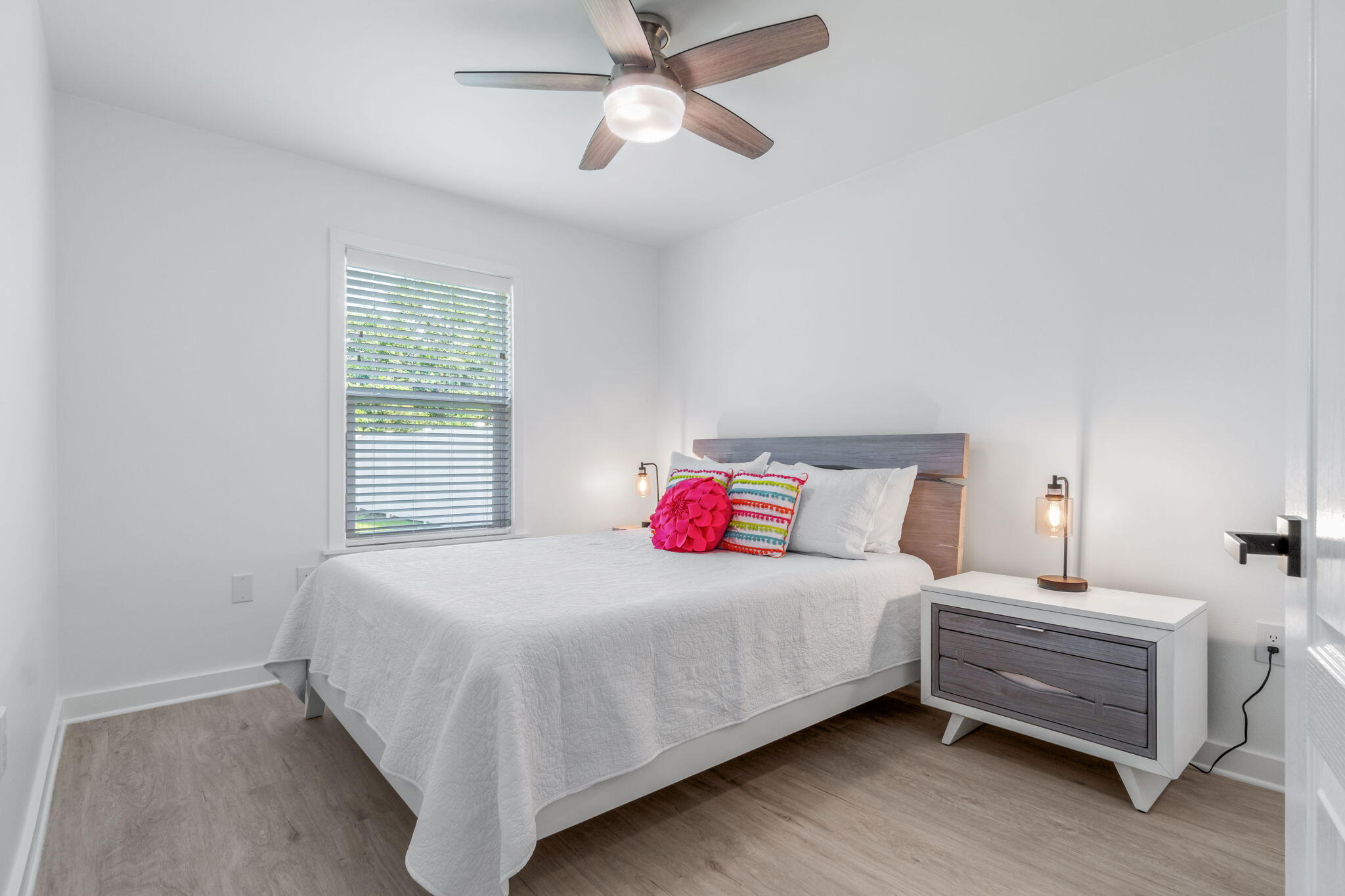 223 Sandy Cay Drive Miramar Beach, FL 32550 - Photo 35 of 79 a bedroom with a bed and a chandelier