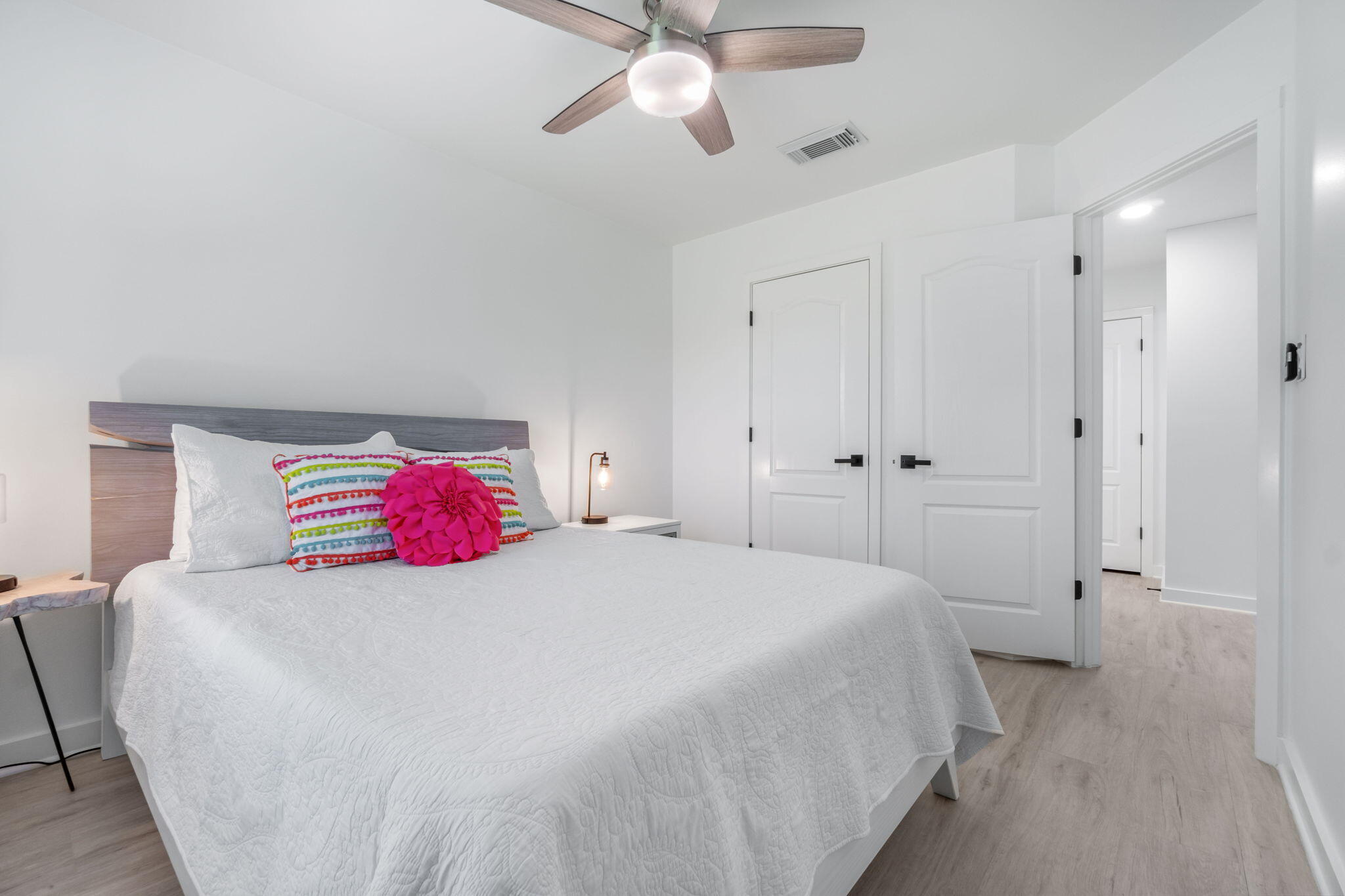 223 Sandy Cay Drive Miramar Beach, FL 32550 - Photo 36 of 79 a bedroom with a bed and a chandelier