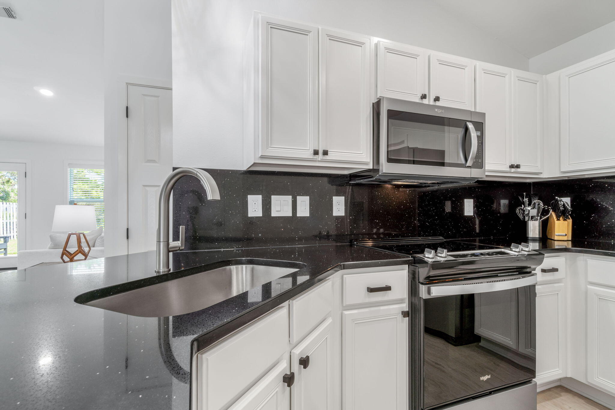 223 Sandy Cay Drive Miramar Beach, FL 32550 - Photo 48 of 79 a kitchen with granite countertop a stove sink and microwave