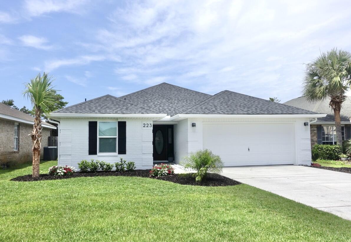 223 Sandy Cay Drive Miramar Beach, FL 32550 - Photo 52 of 79 a front view of house with yard and green space