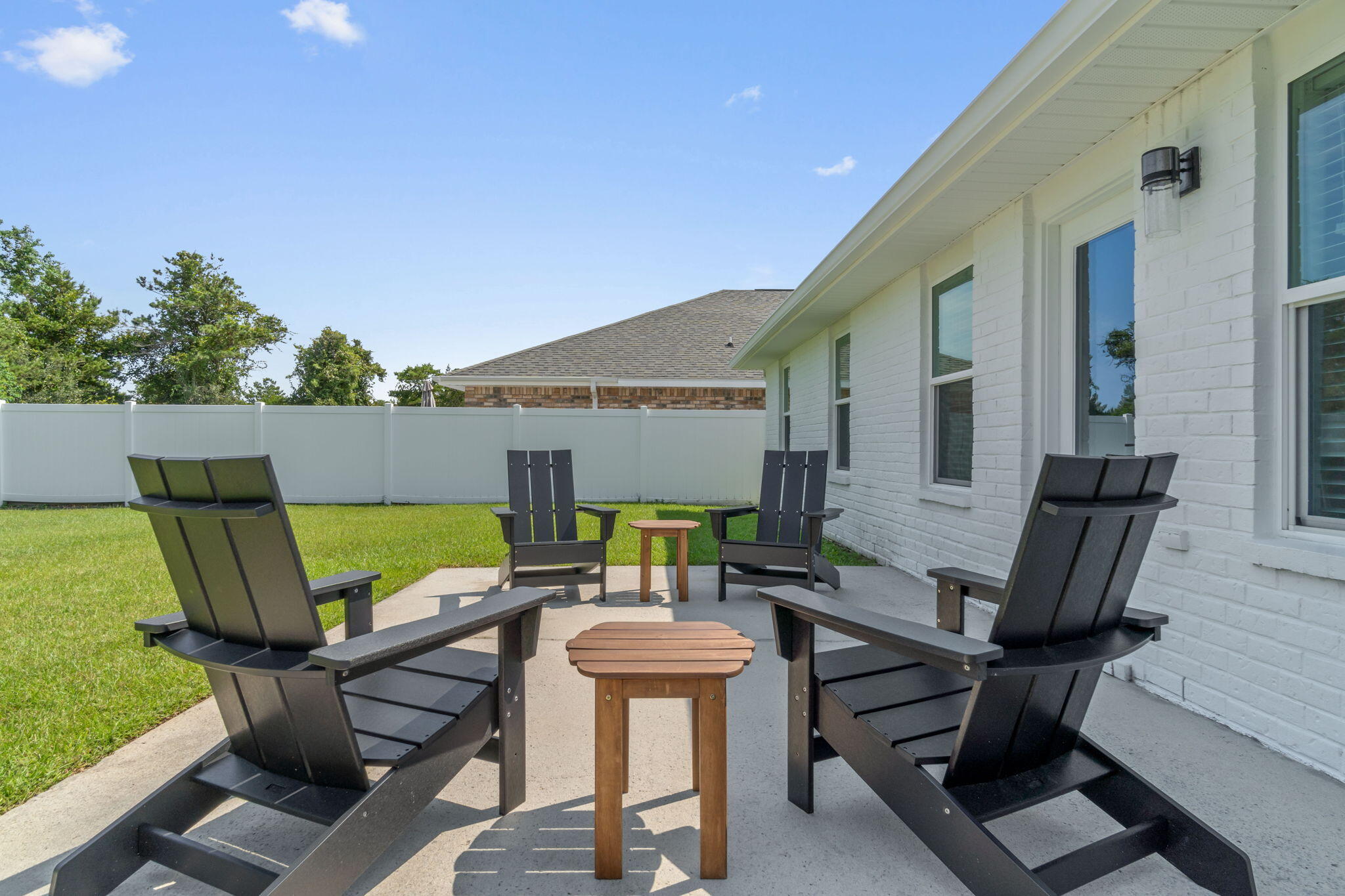 223 Sandy Cay Drive Miramar Beach, FL 32550 - Photo 53 of 79 a patio with glass top table and chairs