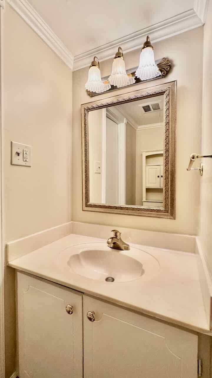5718 Quince Road, Unit 10 Memphis, TN 38119 - Photo 11 of 28 a bathroom with a sink and a mirror