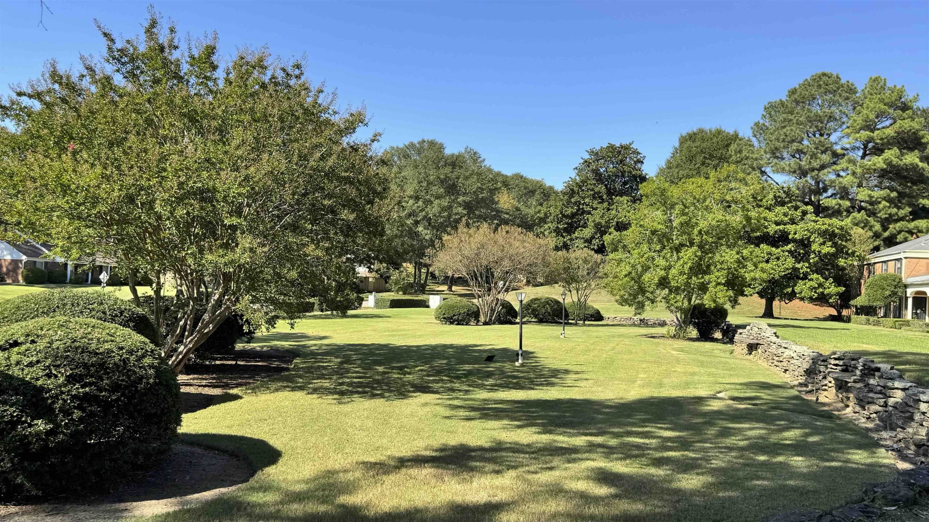 5718 Quince Road, Unit 10 Memphis, TN 38119 - Photo 23 of 28 a view of a swimming pool with a garden