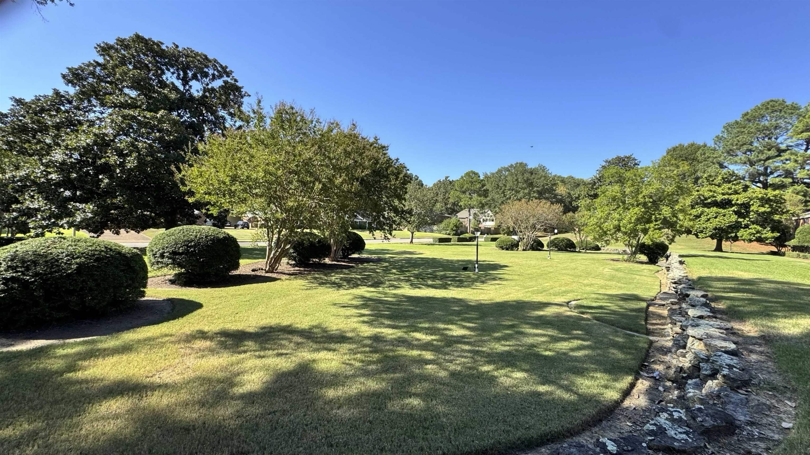 5718 Quince Road, Unit 10 Memphis, TN 38119 - Photo 24 of 28 a view of a golf course with a garden
