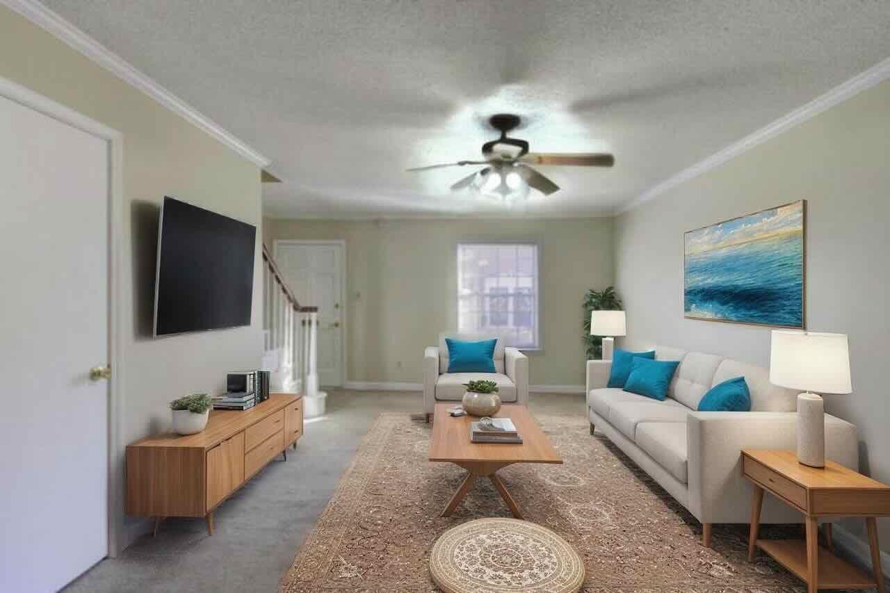 5718 Quince Road, Unit 10 Memphis, TN 38119 - Photo 3 of 28 a living room with furniture and a flat screen tv